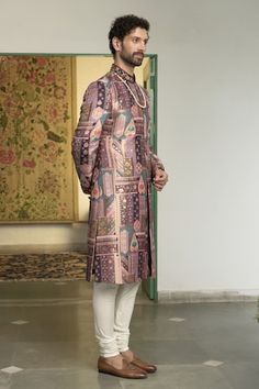 Rose wine sherwani with floral and geometric motifs in a mosaic patterned base, highlighted by placed floral embroidery. Comes with inner kurta and churidar. - Aza Fashions Designer Straight Kurta For Reception, Traditional Kurta With Meenakari, Designer Straight Kurta Sherwani For Diwali, Designer Pink Sherwani, Designer Sherwani Straight Kurta For Festivals, Designer Meenakari Jamawar Kurta, Navratri Designer Sherwani With Naqshi Detailing, Designer Naqshi Sherwani For Navratri, Navratri Designer Sherwani With Naqshi