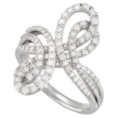 a white gold ring with diamonds on the sides and an intertwined design in the middle