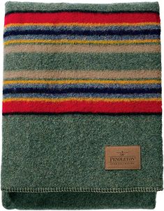 the pendleton blanket in grey with multi - colored stripes