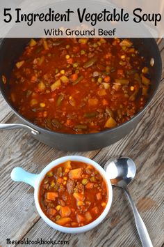 a pot filled with soup next to spoons on top of a wooden table and the words, 5 ingredient vegetable soup with ground beef