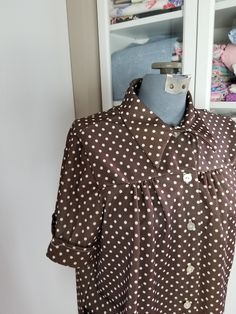 "Cute little polka dot blouse! Made from poly knit, this blouse buttons down the front and has two patch pockets. The front gathers softly into the yoke and has a collared neckline. Label reads, \"Tara One\" Good to fair vintage condition. There are some picks/pulls on the upper back, and a popped section of seam on one sleeve cuff Measurements Bust: Up to 43\" Length: 26\" Size Large" Black Strawberry, Dress And Jacket Set, Antique Clothing, Sleeve Cuff, Beautiful Skirts, Polka Dot Blouse, Button Down Blouse, Dress Suits, Tropical Print