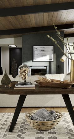 a living room filled with furniture and a wooden table in front of a white couch