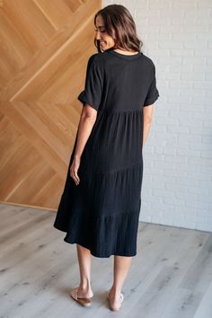 Embrace the journey of growth and discovery with our Always Learning Dolman Sleeve Dress in Black, designed to inspire and empower your everyday adventures. Crafted from crinkle woven fabric, this dress exudes a relaxed sophistication with its textured finish that adds depth and character to your ensemble. The V-neckline frames the décolletage elegantly, offering a flattering silhouette that enhances your natural grace. Crinkle Woven V-Neckline Dolman Sleeve Raw Edge Details Functional Side Pock Dolman Sleeve Dress, Journey Of Growth, Embrace The Journey, Everyday Adventures, Midi Short Sleeve Dress, Always Learning, Lined Skirt, Cardigan Jacket, Dress Romper