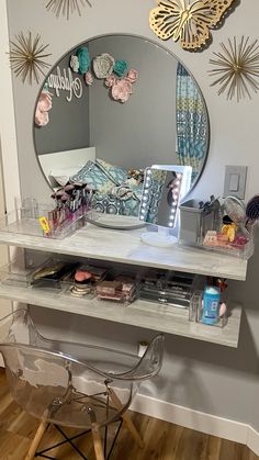 a vanity with a mirror and various items on it