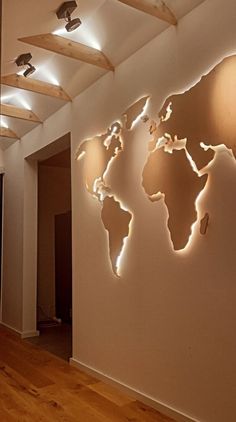 the world map is mounted on the wall