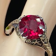 One Antique 14k White Gold Ring, Victorian Design, Circa Approx. 1940-1950's, Ir Prong Set One 8.4mm Synthetic Ruby, Filigree Etching Decorated Throughout The Ring. Weight 2.3gm, No Hallmark, Tested For 14k (1 Inch = 25.4 Mm; 1 Dime = 17.9mm). It Comes With A Complimentary Gift Box. All Jewelry Items Are Pre-Owned Unless Otherwise Stated. This Means They Have The Usual Aspects Of Pre-Owned Jewelry, Such As Light Scratches, Wear And Tarnish. Please Review All The Photos Which Will Be Part Of The Description. Vintage Jewelry With Filigree And Round Cut, Vintage Jewelry With Filigree, Classic Engraved Ruby Ring For Formal Occasions, Vintage Engraved Ring With Filigree, Vintage Engraved Filigree Ring For Formal Occasions, Engraved Vintage Filigree Ring For Formal Occasions, Vintage Ruby Ring With Diamond Cut, Vintage 14k Stamped Filigree Ring For Formal Occasions, Vintage Engraved Ring With Filigree Detail