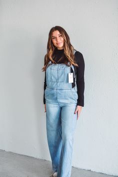 This Everyday Denim Jumpsuit is a must-have for the fashion-forward. Made with stretchy material for a comfortable fit, it features an adjustable strap and a side zipper closure for a perfect fit. The front single pocket and back/front pockets add convenience and style. Elevate your everyday look with this chic and versatile jumpsuit. Model #1 is wearing size Small, and Model #2 is wearing size Medium. Material: 73% Cotton, 27% RayonCare:Machine wash cold, dry on low, iron low. Available in both Medium Wash Denim Overalls With Side Pockets, Medium Wash Overall Jumpsuits And Rompers With Side Pockets, Trendy Light Wash Overalls For Workwear, Utility Light Wash Jumpsuits And Rompers In Overall Style, Utility Light Wash Overall Jumpsuit, Casual Denim Jumpsuit With Zipper Closure, Casual Jumpsuits And Rompers With Zipper, Trendy Medium Wash Denim Jumpsuit With Side Pockets, Medium Wash Overalls With Side Pockets