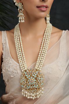 Turquoise Gold Plated Meenakari and Pearl Necklace. This regal Necklace Set is based on material of copper alloy. The four pearl strands end into a beautiful work of meenakari in an intricate floral pattern. the floral pattern is embellished with kundan and pearls ending into a waterfall of pearls. The piece is plated with 22k gold. This beauty is a must in your traditional jewelry collection. LENGTH Necklace Size - 26 inches. Closure - Adjustable Dori. Earring Size- 6 cm DETAILS -100% top Quali Turquoise Kundan Jewelry For Gifts, Turquoise Meenakari Jewelry For Gifts, Blue Meenakari Necklace For Celebration, Turquoise Kundan Necklace With Meenakari Detailing, Traditional Turquoise Kundan Necklace As Gift, Turquoise Meenakari Necklace For Wedding, Temple Jewelry Turquoise Necklaces For Festivals, Turquoise Temple Jewelry Necklaces For Festivals, Turquoise Traditional Jewelry With Intricate Design