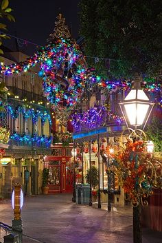 a street with christmas lights and decorations on it