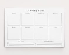 a white weekly planner with the words my weekly plans written on it in black ink