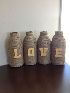 three vases with the word love written on them