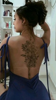 a woman with a tattoo on her back