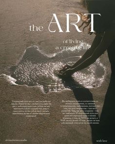 a woman is standing in the sand with her hands on her knees and looking into the water