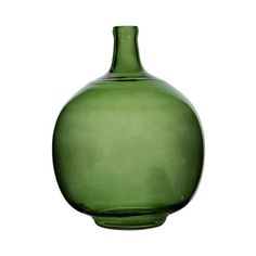 a green vase sitting on top of a white table