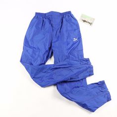 Vintage 90s Puma Spell Out Soccer Pants Pants New The Size Is Small Measurements Are: 30 Inch Inseam 42 Inch Overall Length 12 Inch Waist Lying Flat Blue Nylon Check Out My Other Items In My Store! N132 Blue Nylon Jogging Pants, Blue Nylon Pants For Jogging, Blue Pants With Elastic Waistband For Outdoor Activities, Blue Moisture-wicking Nylon Pants, Blue Stretch Pants For Outdoor, Blue Bottoms With Elastic Waistband For Outdoor Activities, Blue Waterproof Sports Bottoms, Blue Waterproof Nylon Bottoms, Waterproof Blue Nylon Bottoms