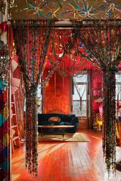 a living room decorated in bright colors and beads