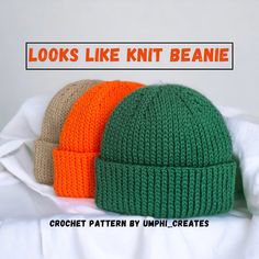 two knit beanies sitting on top of a white bed with the words looks like knit beanie