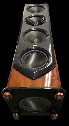 a very nice looking speaker with some speakers on it's sides and two sub woots in the middle