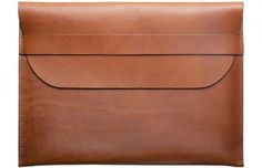 a brown leather envelope on a white background