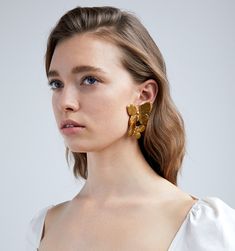 For centuries, butterflies have been symbolic of transformation and the ability to overcome, which makes them our perfect everyday mascot! The Papillon Earring is both a best-seller and a staff favorite. The curved shape of the butterflies flatteringly frame the face, while the intricately-carved details on the wings make these true wearable masterpieces.  Dimensions: 2.25in L Weight: $225.00 Elegant Butterfly Charm Earrings, Elegant Butterfly Earrings For Formal Occasions, Elegant Single Butterfly Earring, Luxury Gold Butterfly Earrings, Luxury Yellow Gold Butterfly Earrings, Gold Earrings With Butterfly Charm For Formal Events, Gold Earrings With Butterfly Charm For Formal Occasion, A Staff, The Wings