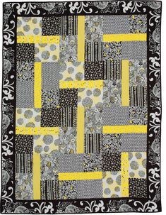 an image of a black and yellow quilt on the page, which is featured in this article