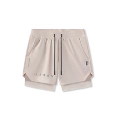 a white shorts with zippers on the side and an inscription that reads,'i am