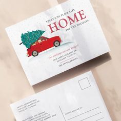 a postcard with a red car carrying a christmas tree on it and the words, there's no place like home for the holidays