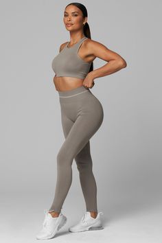 Introducing LiCi's True Form collection, a seamless activewear line that serves as a reminder to be true to yourself. Crafted with a fabric that feels silky smooth to the touch, and enhanced with a full interlocking knit construction, this collection offers the perfect combination of compression and breathability. Full Coverage Jewel Neckline With Removable Pads Racer Back 2-Tier Ribbed Under Band Detail With Multi-Support Compression Levels LiCi Logo placement center back Fabric: Seamless 90% N High Stretch Smoothing Activewear, Sporty High-stretch Smoothing Activewear, Versatile Compressive Smoothing Activewear, Micro-elastic Smoothing Sporty Activewear, Micro-elastic Sporty Activewear With Smoothing Details, Stretch Sports Bra For Loungewear, Sporty Activewear With Smoothing Micro-elastic Fit, Sporty Micro-elastic Activewear With Smoothing Details, Seamless Stretch Elastane Activewear