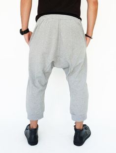 "🚚..ALL ORDERS ARE SHIPPED VIA DHL EXPRESS MAIL Harem-style sweatpants with a cropped profile. Made of stretch cotton-blend jersey, these cropped pants are comfortable to wear and easy to move in. * Pull-on style * Drop-crotch style * Elastic waistband with black drawstring * Side slant pockets * Ribbed ankle cuffs * Cropped length Measurements approximately: Waist: 27\" (68.5 cm) stretching to 48\" (122 cm) Hips: 50\" (127 cm) Outseam: 31\" (79 cm) In Front Rise: 17 1/2\" (44 cm) In Back Rise: Hip Hop Baggy Loungewear Pants, Gray Hip Hop Long Pants, Hip Hop Style Wide Leg Pants With Hip Pockets, Baggy Straight Hip Hop Pants, Baggy Harem Pants With Hip Pockets, Hip Hop Long Pants With Pockets, Baggy Full-length Sweatpants With Hip Pockets, Hip Hop Style Long Pants With Pockets, Hip Hop Style Stretch Bottoms With Pockets