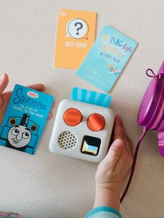 a child is playing with some toys on the floor and it looks like they're learning