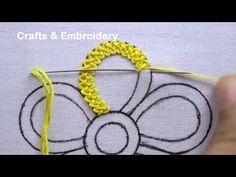 someone is crocheting an object with yellow thread and the words crafts & embroidery written on it