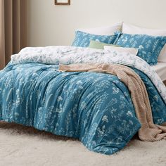 PRICES MAY VARY. Unique Reversible Design: This floral comforter set is reversible with contrasting colors. Simply flip the comforter or the pillow shams over to refresh your interior decor. The vivid floral and tree branch patterns add an elegant touch and a botanical vibe to your sleeping space. Optimal Comfort: Featuring Bedsure's thoroughly tested, high-grade down alternative filling blend to provide right warmth while ensuring optimal support, this polyester microfiber comforter set offers Bedsure Bedding, Bedding Comforter Sets, Flower Comforter, Floral Comforter Sets, Queen Bedding, Floral Bedding Sets, Blue Comforter, Twin Xl Comforter, Bedding Comforter