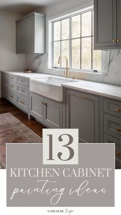 a kitchen with gray cabinets and white counter tops