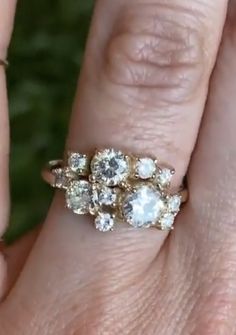 a woman's hand with three rings on it