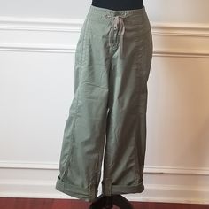 These Are Great Avenue Capris. Avenue Clothing Is Well Made And Items That Will Last For A Long Time In Your Wardrobe. These Are Timeless Capris, That Never Go Out Of Style. Great Green Color, Awesome Stitching Throughout The Pants, Pockets On Side & Back And Drawstring. 98% Cotton, 2% Spandex With A Little Give. Inseam 24 Inches, Waist 19 Inches Flat. Please Reach Out With Any Questions You May Have. Great Posh Find. Have Been Laundered. ! Spring Military Wide Leg Pants, Spring Utility Bottoms With Buttons, Casual Cotton Cargo Pants With Buttons, Casual Straight Leg Cargo Pants With Buttons, Casual Khaki Cargo Pants With Button Closure, Spring Military Style Cotton Pants, Spring Cotton Military Pants, Military Style Relaxed Fit Pants For Spring, Spring Military Style Khaki Bottoms