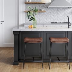 two stools in front of a kitchen island