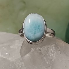 Natural Blue Larimar Ring Set In .925 Solid Sterling Silver. This Pendant Is 5.81cts And Weighs 4.15 Grams. Larimar Is Mined Only One Place On Earth And That Is From The Volcanic Mountains In The Dominican Republic. It Is A Stone That While It Was Created In The Hot, Red, Magma Tubes Of A Volcano, Is A Cool Spectrum Of Blues And Teals Webbed With White Patterns That Remind Us Of Both The Surf And Sky Of The Caribbean. It Is No Surprise That The Color And Feel Of This Stone Brings Joy, Happiness Sun People, Walking Along The Beach, Volcanic Mountains, Larimar Ring, Larimar Rings, Caribbean Wedding, On The Ocean, Brings Joy, The Dominican Republic