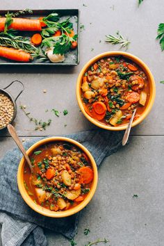 two bowls of stew with carrots and lentils