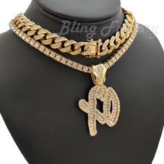 Hip Hop XO Gang pendant & 18" Iced Box Lock Cuban & Tennis Choker Chain Necklace HIP HOP CELEBRITY STYLE BRAND NEW USA SELLER Product Description Hip Hop Iced Cuban Choker Chain  Hip Hop Celebrity Style Chain 12mm 18" Iced Box Lock Cuban Chain Lab Diamonds on Chain & Pendant 14K Gold plated Pendant : Hip Hop Celebrity Style Pendant Pendant Size : 37mm x 40mm 14K Gold plated 1 Row Tennis Chain : Hip Hop celebrity full Iced 1 Row Tennis Chain Length : 18" 4.5mm Width Luxury Bling Bracelet Lab Diam Cuban Choker, Chain Ideas, Choker Chain Necklace, Indian Choker Necklace, Pendant Ideas, Choker Chain, Choker Pendant