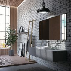 a modern bathroom with brick walls and flooring is shown in this image, there are two sinks on either side of the mirror