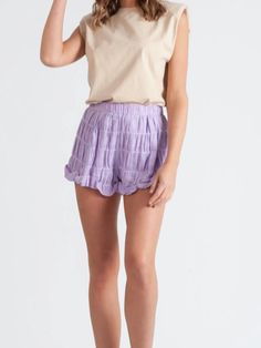 Wisteria Lilac Ruffle Shorts | Sassy Shortcake Lavender Bottoms With Elastic Waistband For Spring, Lavender Short Bottoms For Spring, Short Lavender Bottoms For Spring, Spring Purple Shorts With Elastic Waistband, Lavender Short Length Bottoms For Spring, Casual Purple Tiered Skirt, Casual Ruched Shorts, Summer Lavender Bottoms With Ruffles, Summer Lavender Ruffled Bottoms