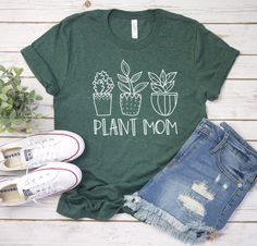 Plant Mom Shirt, Plant Mama, Plant Lady, Funny Graphic Tee, Plant Mom Gift, Funny Plant Shirt, Wildflower Shirt, Shirt For women, Garden tee Unisex T Shirt  is made of super soft  lightweight cottonT-shirt is made of Pre-shrunk 100% ultra soft cotton, runs true to size, unisex standard fit shirt» Deep Heather is 52/48 combed and ringspun cotton/polyester,» Sport grey and Black Heather are 90/10 combed and ringspun cotton/polyester» Prism Colors: 99% combed and ring-spun cotton, 1% polyester» lig Green Graphic Tee For Mother's Day, Mother's Day Green Graphic Tee, Mother's Day Green Short Sleeve T-shirt, Green Short Sleeve T-shirt For Mother's Day, Green Cotton T-shirt With Plant Print, Summer Cotton Shirt For Gardening, Cotton Shirt For Gardening In Summer, Green Relaxed Fit Shirt With Plant Print, Relaxed Fit Green Shirt With Plant Print