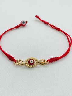 "Pulsera hecha a mano con el ojo rojo para la proteccion en oro chapeado terminado con hilo rojo reforzado delgado. hecha exclusiva para mujer. pulsera ajustable y expandible con cierre de candado minimo de 6.5\" pulgadas y maximo de 7\" pulgadas Aviso : si no es de su medida la pulsera; contactenos antes de comprar porque podemos hacer la medida que desea material: hilo rojo reforzado #A bola del mal ojo rojo 6mm cadena y del mal ojo en oro chapeado" Red Evil Eye Bracelets For Good Luck, Red Evil Eye Bracelet For Good Luck, Gold Resizable Evil Eye Spiritual Bracelet, Gold Resizable Spiritual Evil Eye Bracelet, Resizable Gold Spiritual Evil Eye Bracelet, Adjustable Red Evil Eye Jewelry, Red Adjustable Evil Eye Jewelry, Gold Adjustable Evil Eye Bracelet For Good Luck, Adjustable Gold Eye-shaped Jewelry