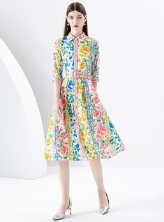 "Brilliantly blossoming with an exuberant array of flowers, this midi dress is an ode to the vibrant palette of a lush, sun-drenched garden. The artful symphony of roses, daisies, and wildflowers printed across the fabric mirrors a canvas painted with the whimsical colors of spring and summer. Designed with a classic shirt collar and graceful elbow-length sleeves, the dress exudes a vintage charm underscored by the crisp pleats of its full skirt. A cinched waist, marked by a beautifully detailed Push Up Swimsuit, Sleeveless Dresses Casual, Multicolor Floral Print Button-up Shirt Dress, Printed Tankini, White Maxi, Pink Midi Dress, Maxi Dress Party, Elbow Length Sleeve, Lingerie Sleepwear