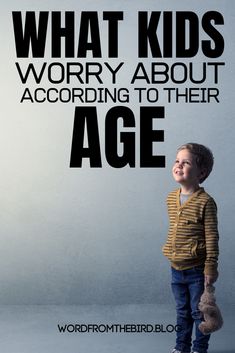 a young boy standing in front of a white wall with the words, what kids worry about according to their age