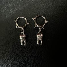 The cutest tooth earrings ever!  Comes in a jewelry/gift box :) Stainless steel so should not tarnish. Care Notes: do not wear it in the shower or in the pool. Silver Jewelry Aesthetic Earrings, Barbed Wire Earrings, Y2k Gifts, Teeth Earrings, Alternative Earrings, Tooth Earrings, Yokai Watch, Stud Jewelry, Funky Jewelry