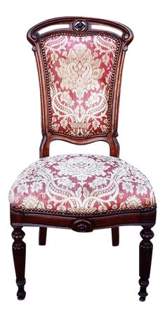 an ornate wooden chair with red and white upholstered fabric on it's back