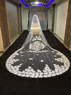 a wedding veil is on the floor in an empty room