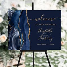 a blue and gold marble wedding sign with the words welcome to our wedding on it