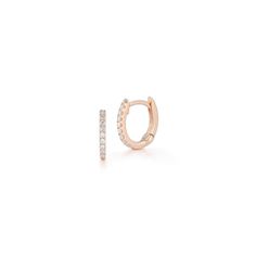 Our DRD Huggies are the quintessential gold and diamond huggie earrings. Sized at 10.5mm in length, they are dainty, delicate, and oh so sparkly with 0.13ctw of white pavé set round diamonds set in 14 karat gold. Essential for any ear stack, the DRD Huggies are one of our most popular and sought-after styles. Our beloved diamond huggies pair well with anything from diamond hoop earrings to a stud to a statement earring. At 10.5mm, they are a touch larger than our Mini Huggies, which are 9mm in l Fine Jewelry Huggie Earrings With Pave Setting, Diamond White Huggie Earrings With Pave Setting, Diamond White Pave Huggie Earrings, Fine Jewelry Diamond Huggie Earrings With Pave Setting, Timeless Diamond Huggie Earrings With Pave Setting, Rose Gold Brilliant Cut Cubic Zirconia Huggie Earrings, Sterling Silver Rose Gold Huggie Earrings With Diamond Accents, Diamond Huggie Earrings With Pave Setting, Rose Gold Sterling Silver Huggie Earrings With Diamond Accents